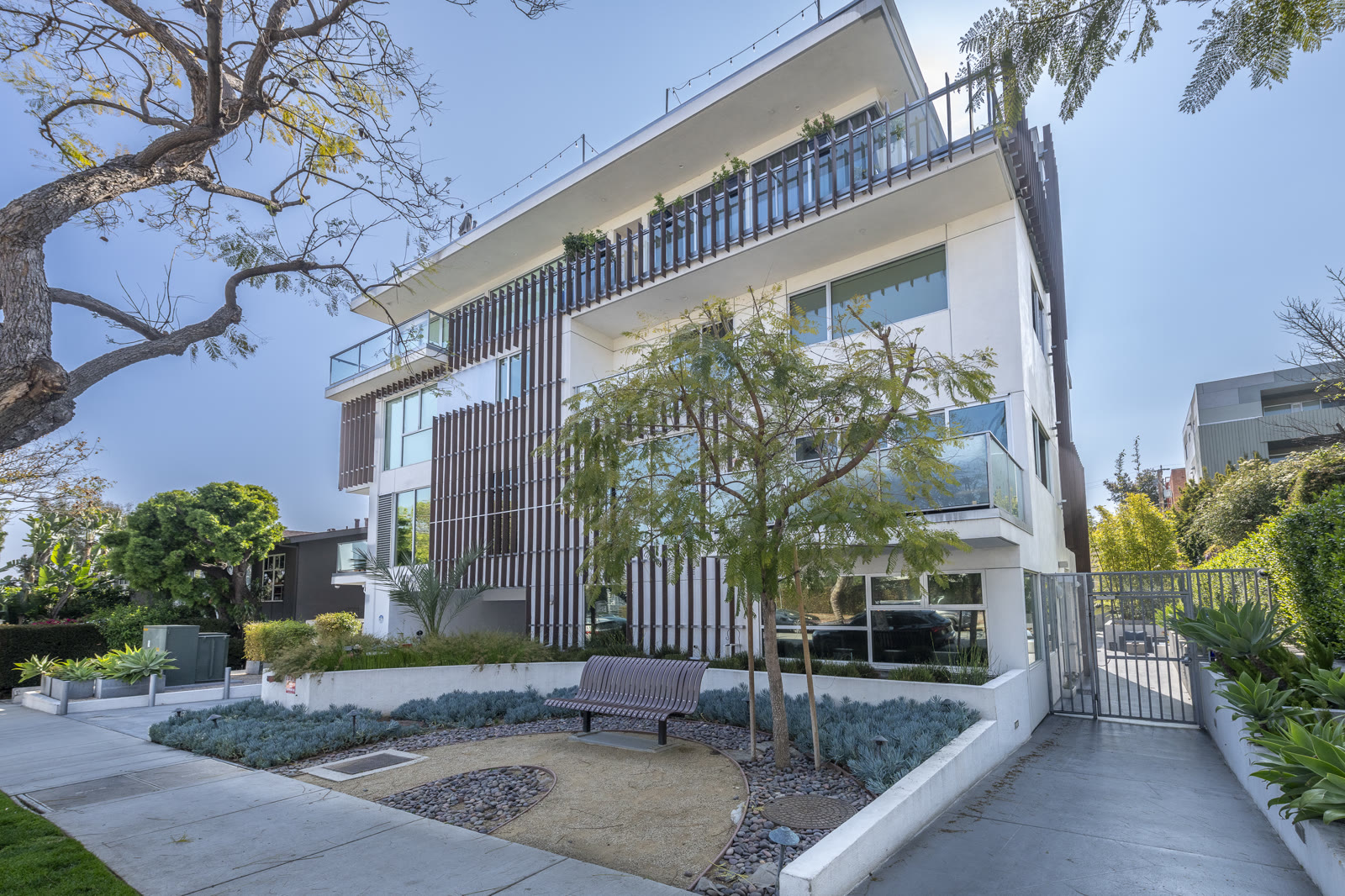 Modern architectural townhome exterior at 1345 N Havenhurst Drive